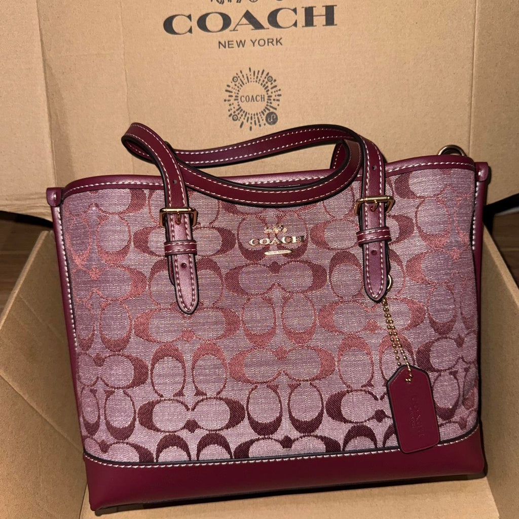 Burgundy Coach Signature canvas shoulder bag