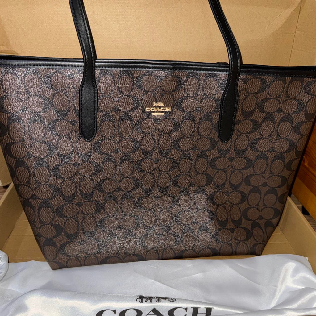 Brown and black Coach leather tote bag