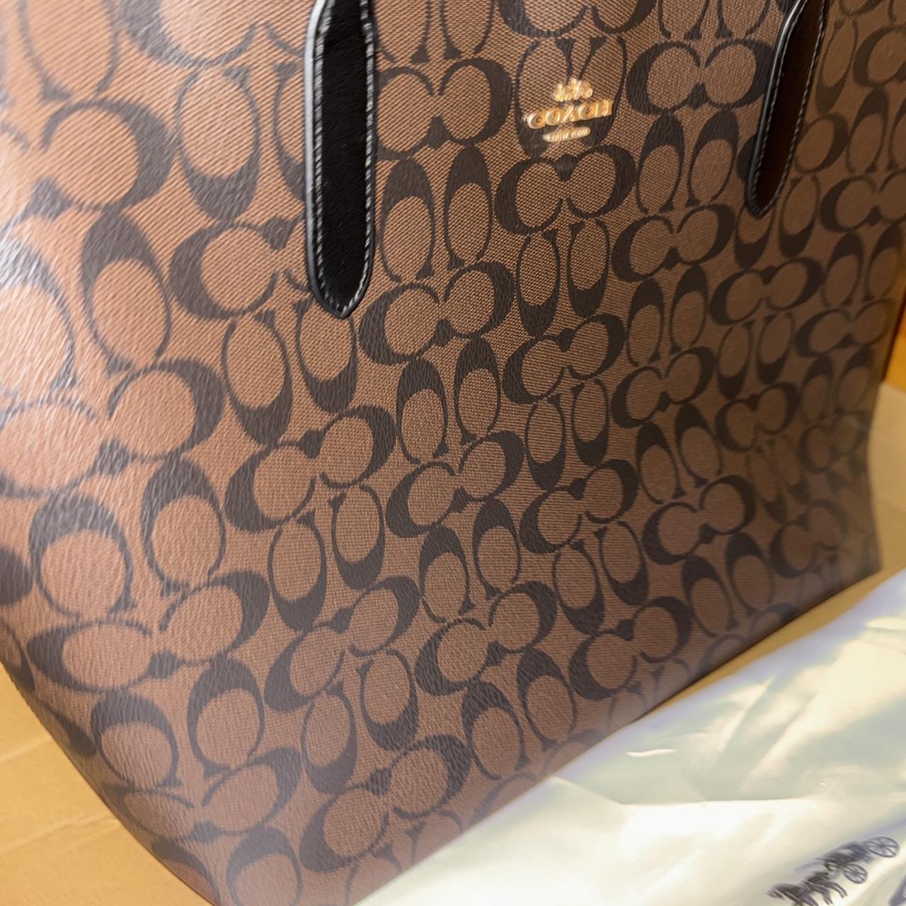 Brown and black Coach leather tote bag